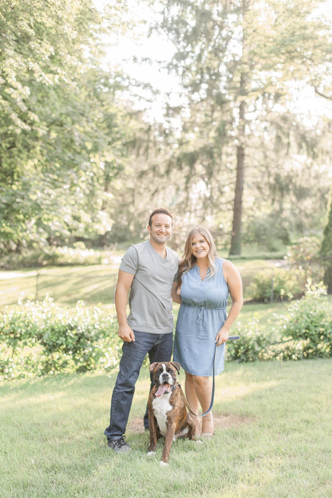Light & airy engagement photo with Boxer dog