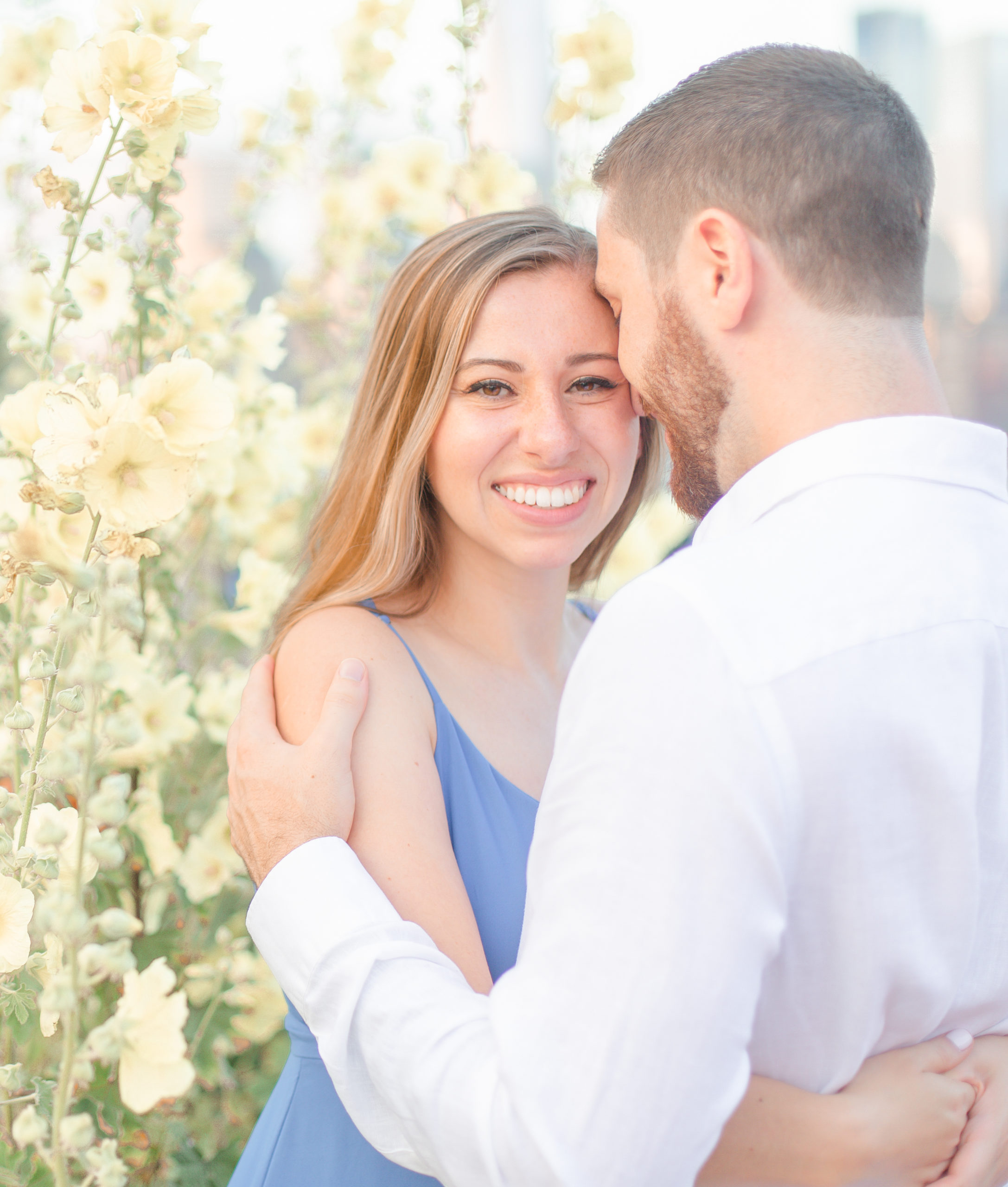 light and airy engagement photo at liberty state park