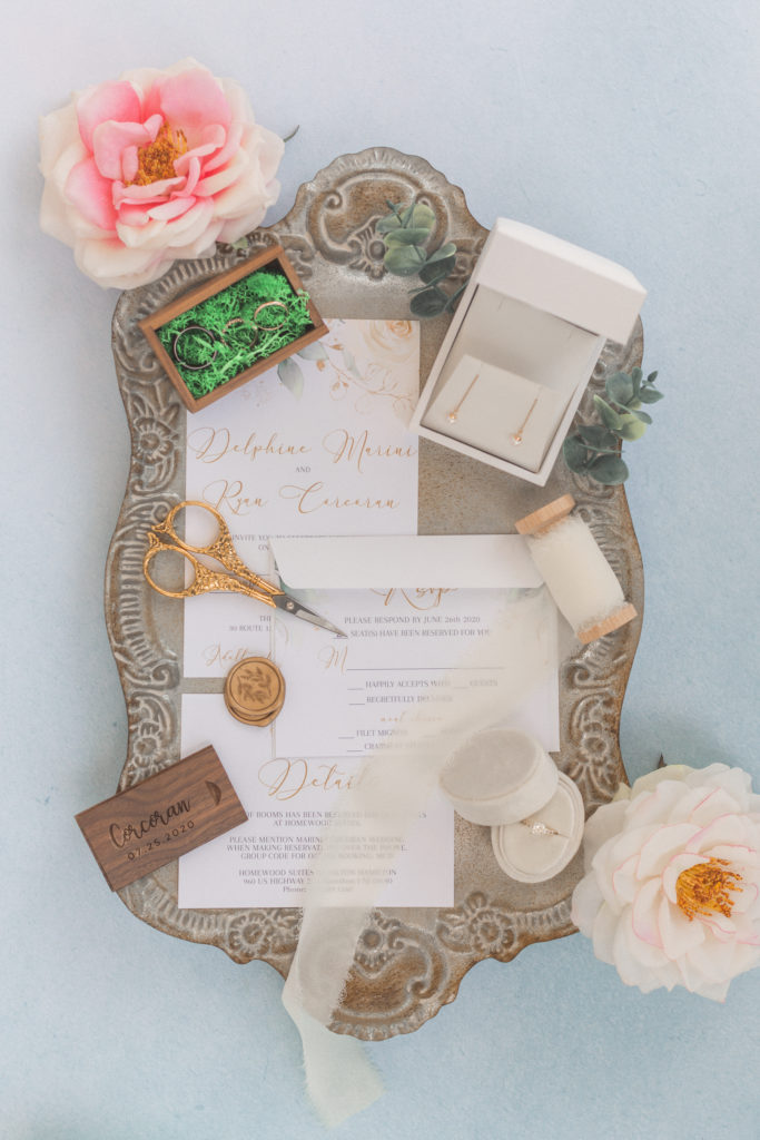 light and airy flaylay wedding photo of invitations and rings