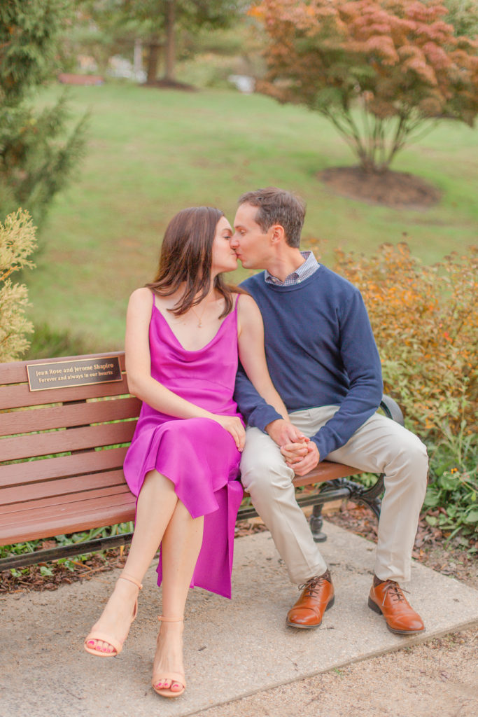 couple kissing on bench fall engagement photography new jersey wedding photographers 