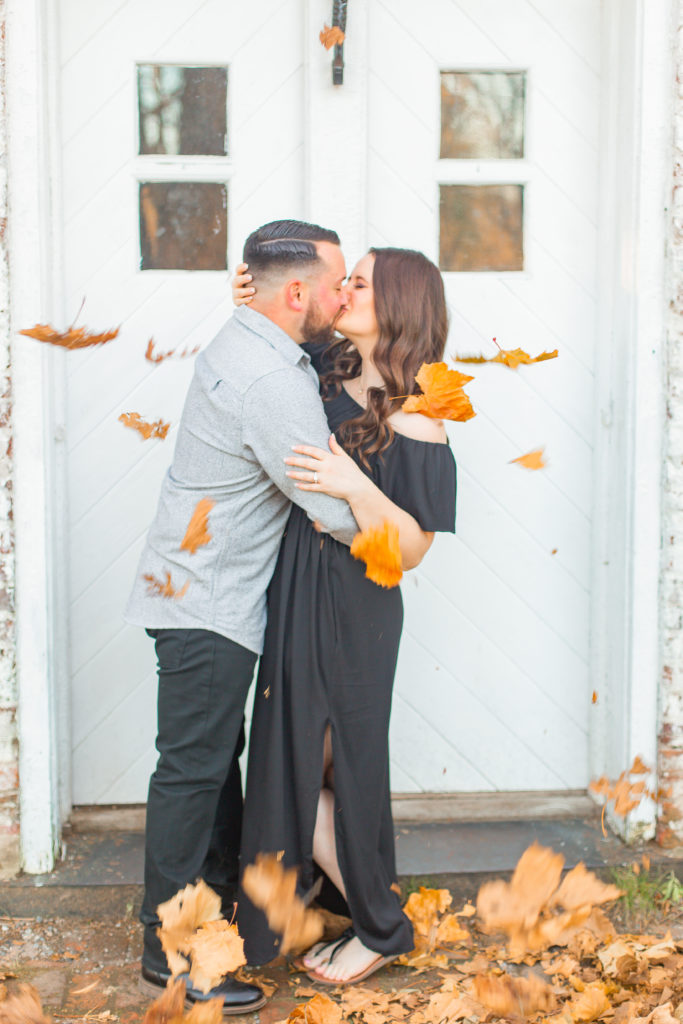 fall leaves falling engagement photo