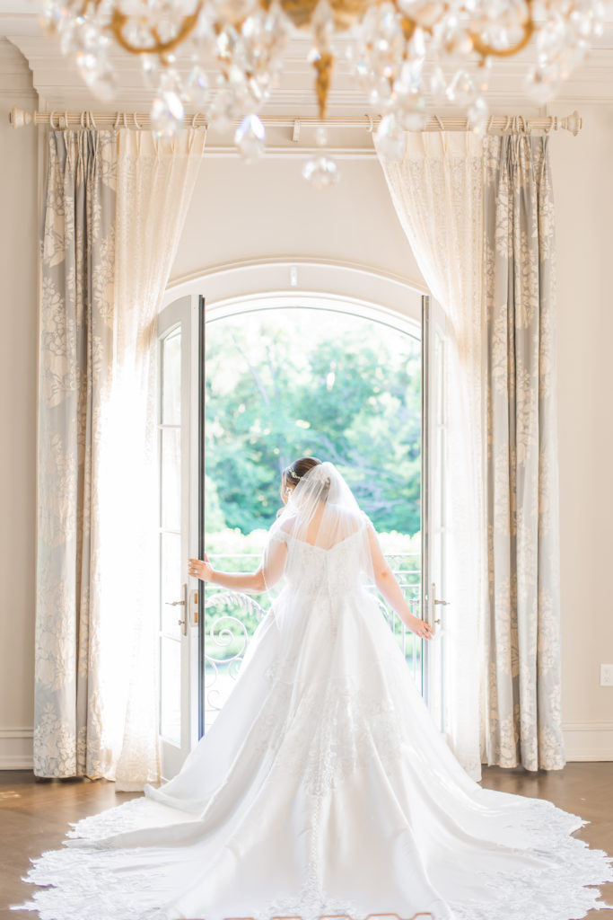 light and airy new jersey wedding photography of bride getting ready in bridal suite at the park chateau 